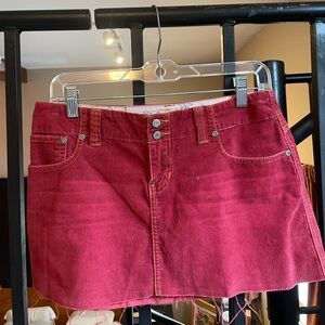 Vintage raspberry color corduroy mini skirt.